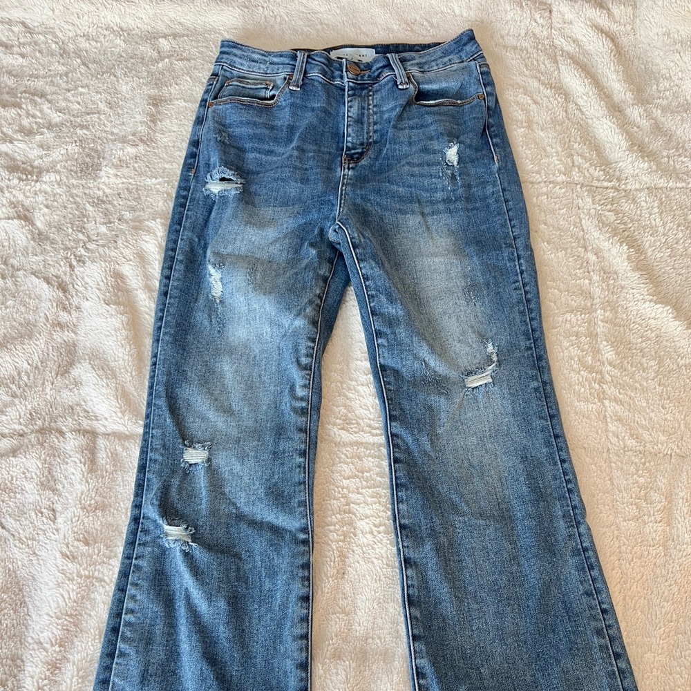 Risen distressed wide leg flare jeans